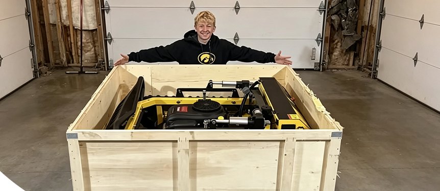 Mower secured in an export wooden crate
